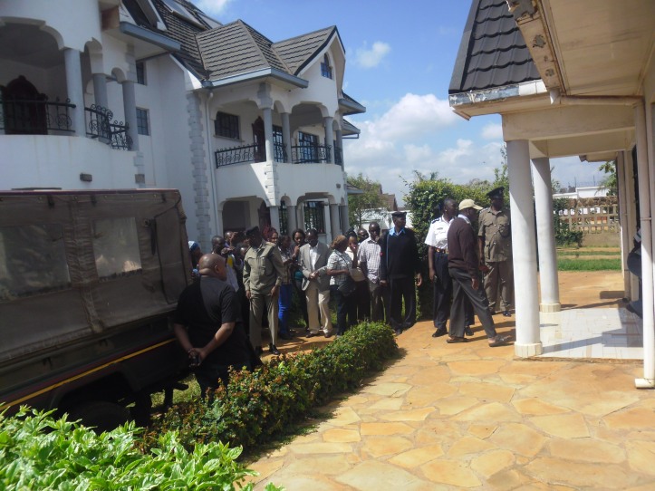 police-family-and-friends-sorround-the-body-of-joyce-wambui-a-businesswoman-who-was-killed-by-unknown-muggers-at-her-maki-estate-in-thika-on-monday-night